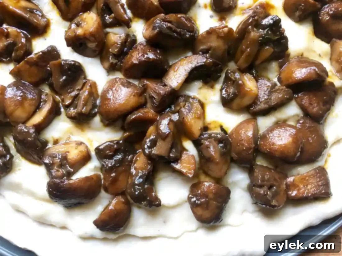 Freshly baked Mushroom Marsala Pizza, golden and bubbly.