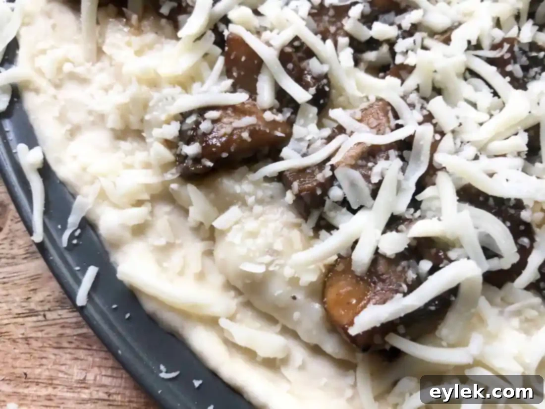 Another close-up of a Mushroom Marsala Pizza slice, emphasizing the textures.