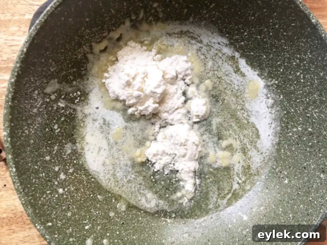 Melted butter in a small saucepan, ready for the flour.