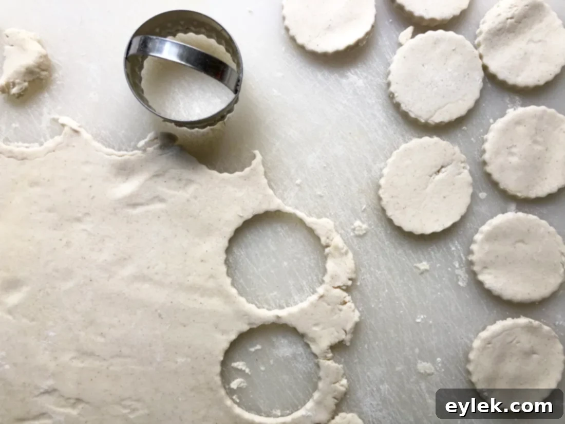 rolling out gluten-free pie dough for cobbler topping