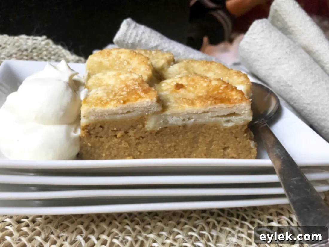 slice of gluten-free pumpkin pie cobbler with whipped cream