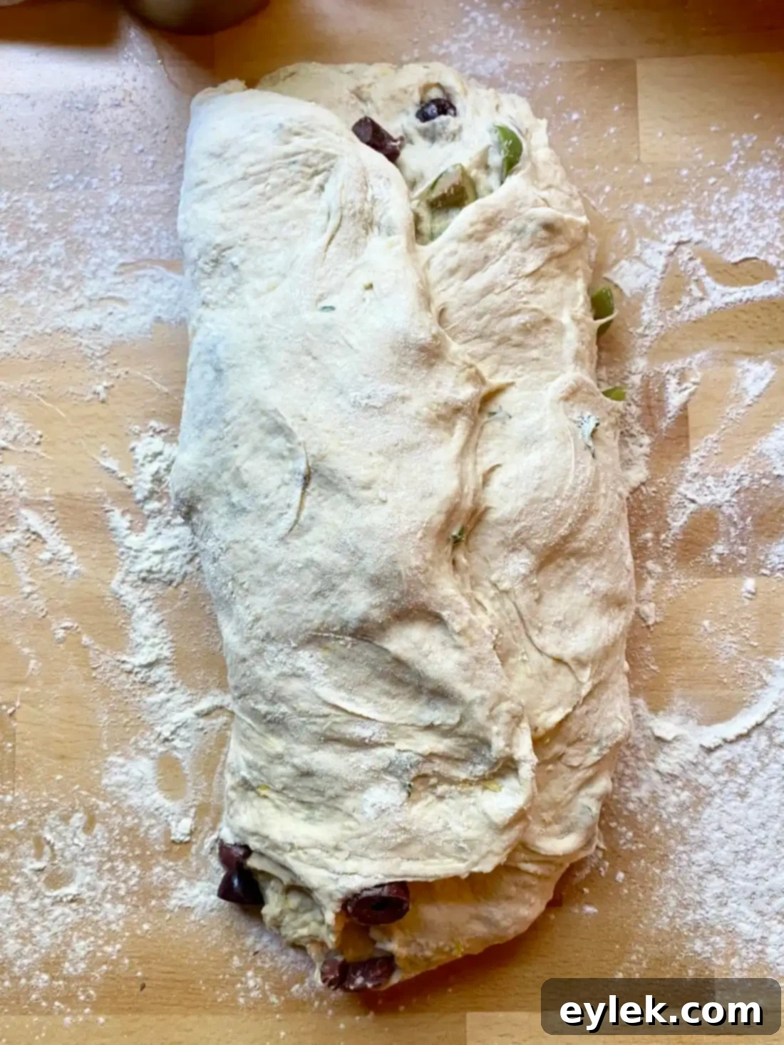 Zesty Olive Thyme Loaf 15 Tucking dough for final shape