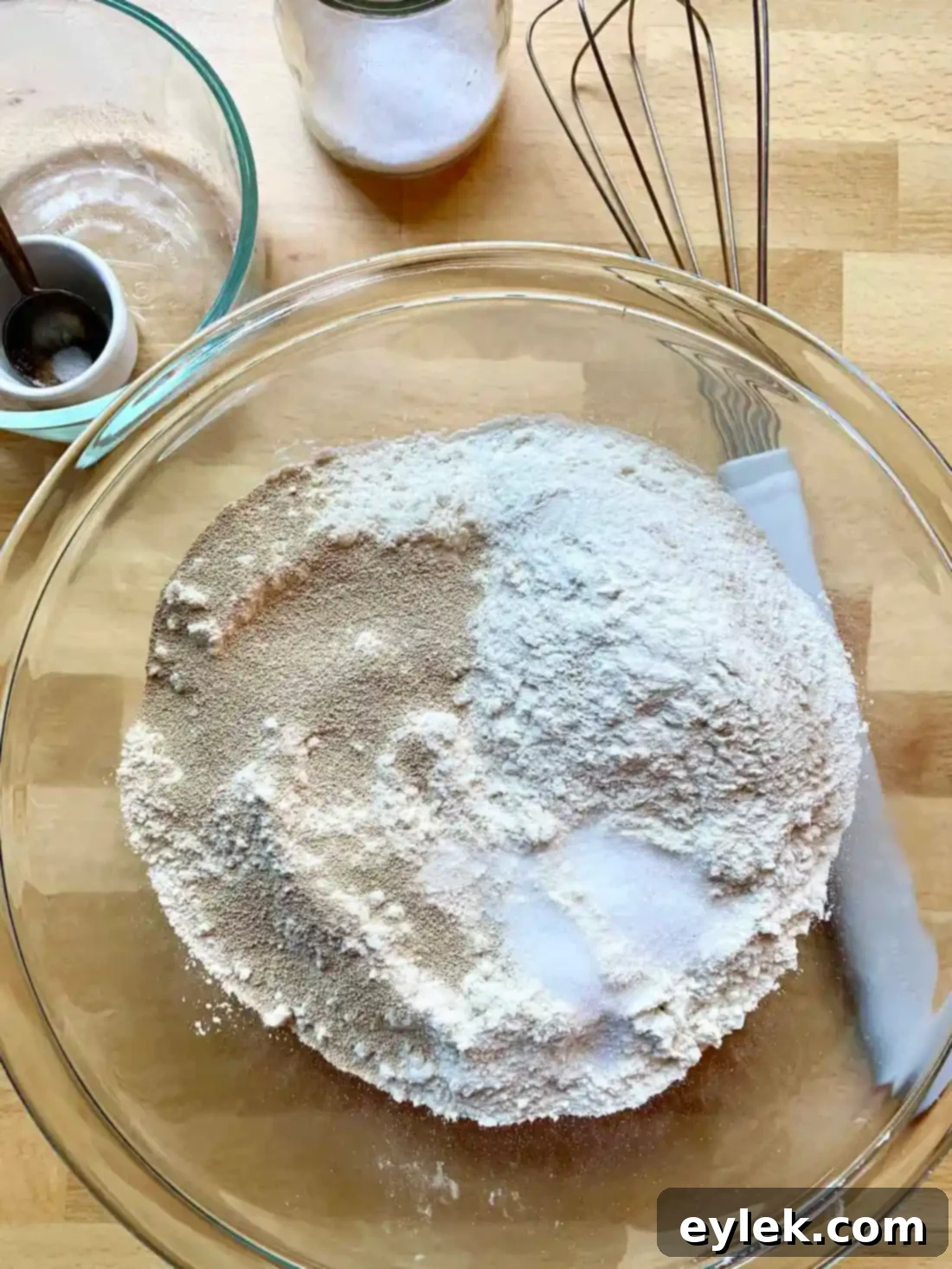 Zesty Olive Thyme Loaf 3 Ingredients for olive bread with lemon and thyme on a wooden board