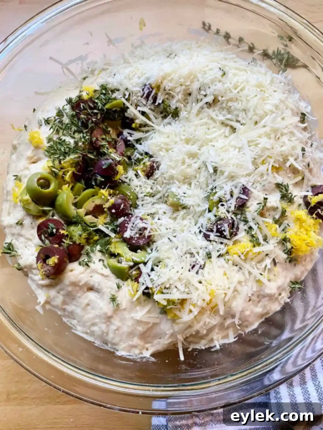 Zesty Olive Thyme Loaf 10 Folding dough with olives, lemon, and thyme