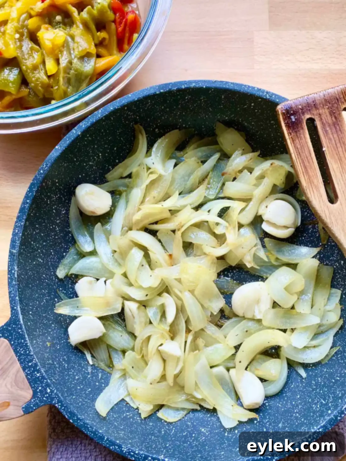 Adding crushed tomatoes to the pepper mixture