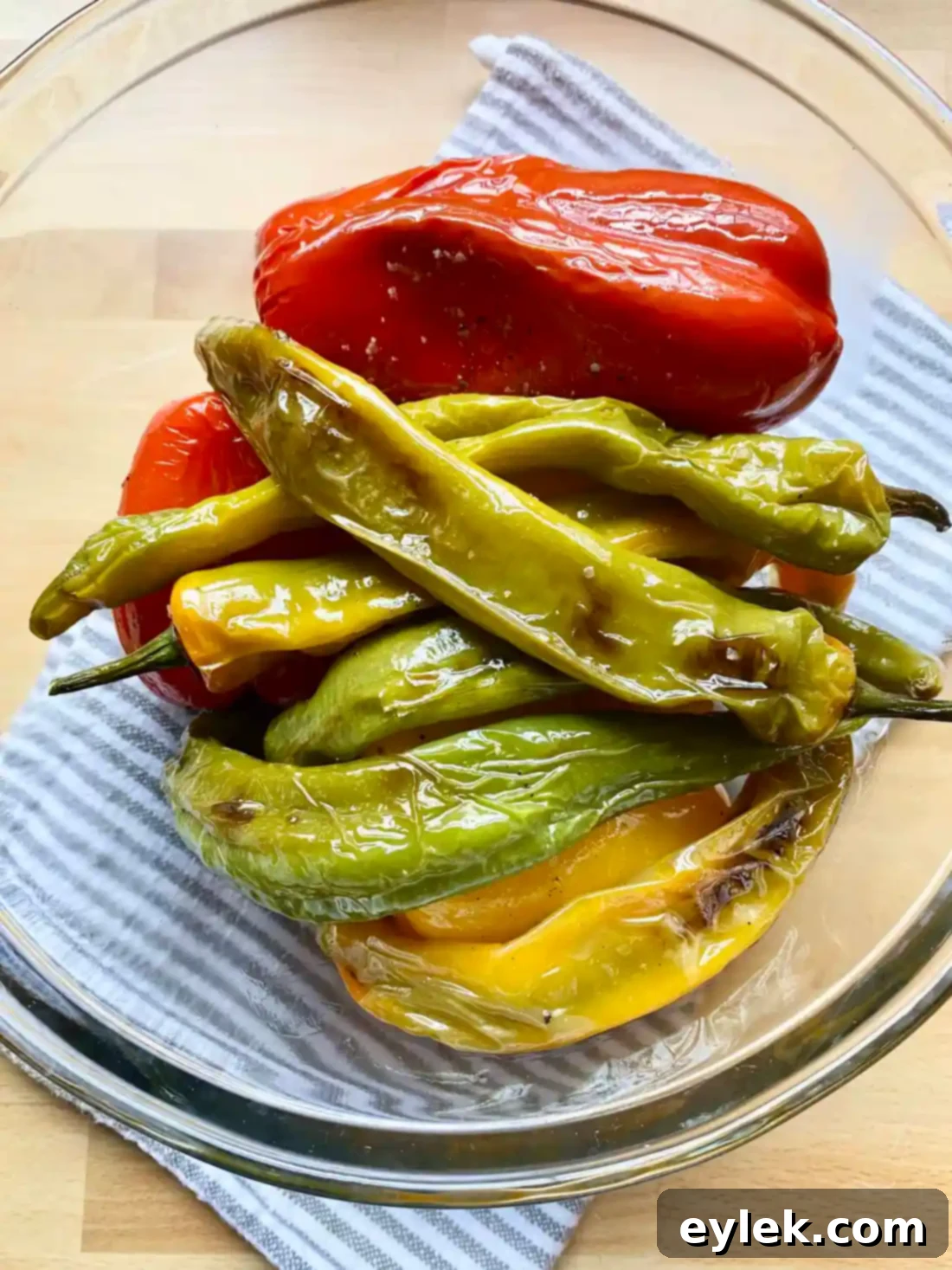 Roasted peppers in a bowl ready for steaming