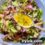 Classic French Dijon Vinaigrette in a glass jar, ready for serving.