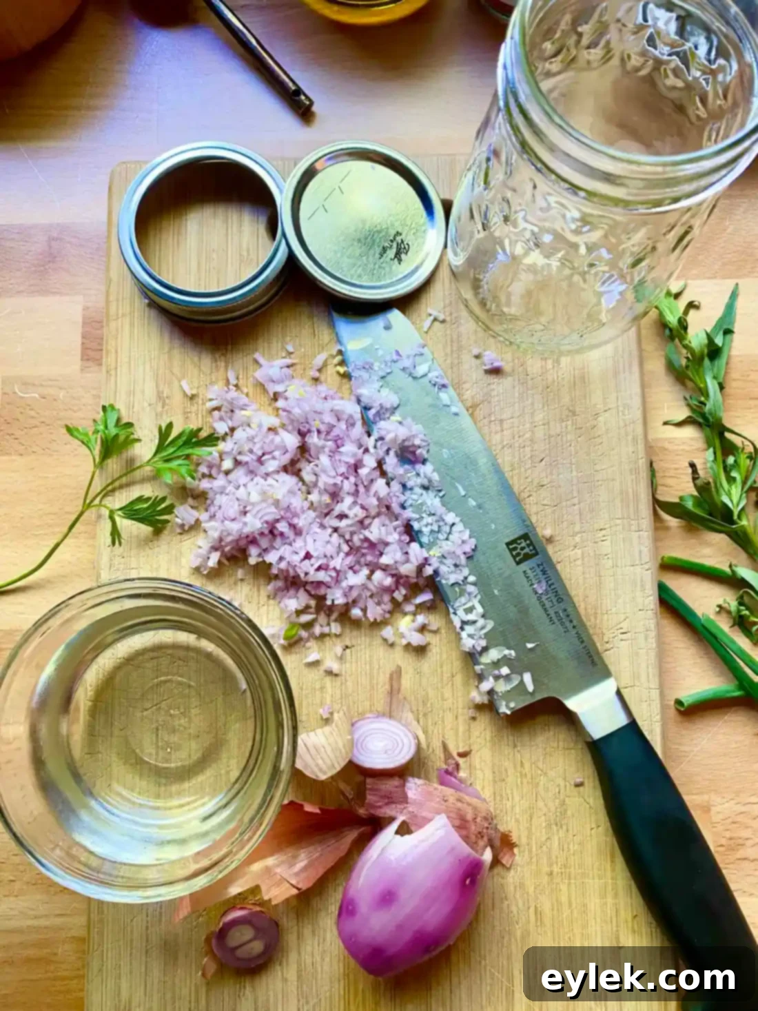 Whisking the ingredients for French Dijon Vinaigrette in a glass measuring cup.