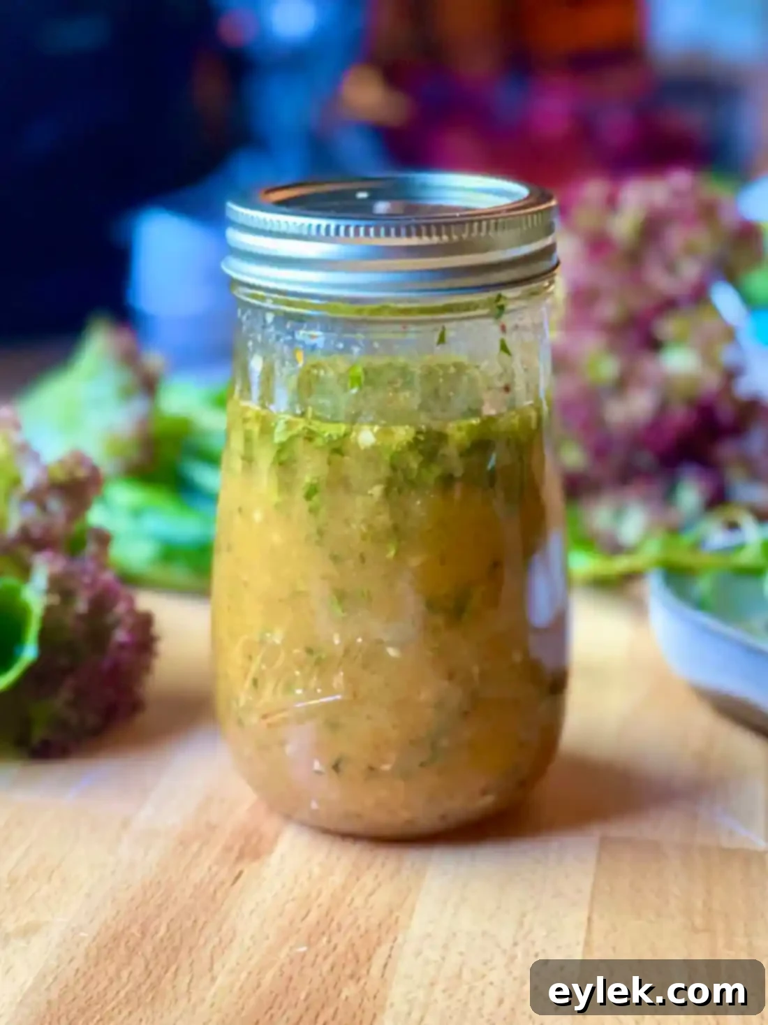 The final Classic French Dijon Vinaigrette in a glass jar, ready to be served.
